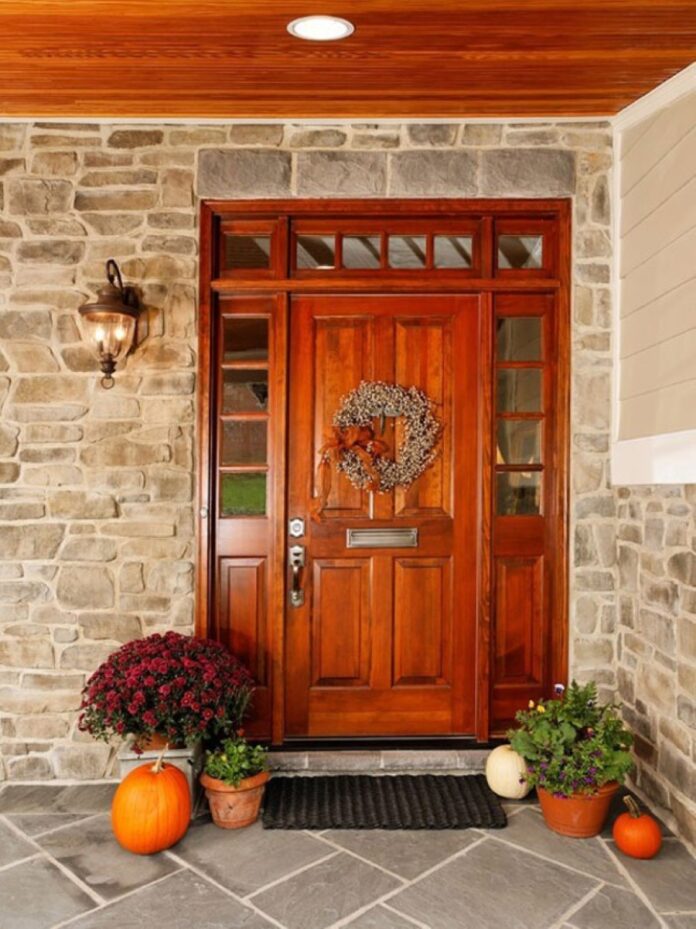 adorable-furnished-wooden-front-door-design-with-double-glass-accent-and-christmas-decoration-beneath-stone-brick-walland-wooden-ceiling-design-with-pumpkins Vaastu