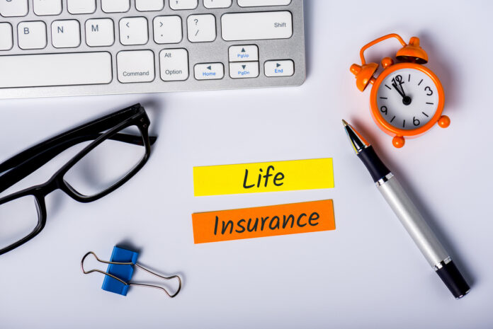 Life insurance - text on insurer workplace. Healthcare, accident and medical insurance concept